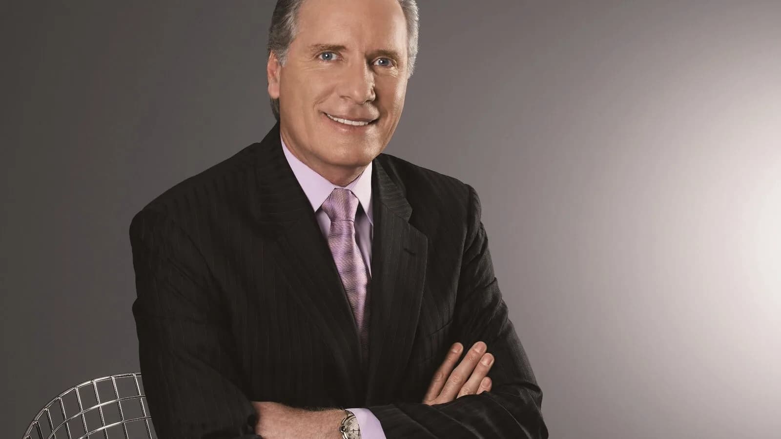Retrato de Roberto Justus, empresário e apresentador, de terno escuro